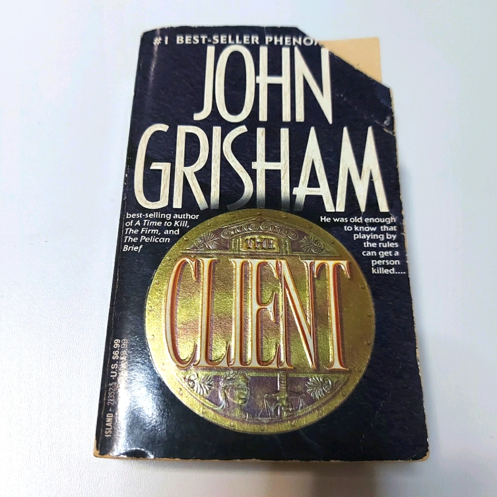 Free When You Spend $50 John Grisham- The Client
